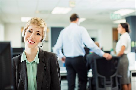 simsearch:6113-07243082,k - Businesswoman wearing headset in office Stock Photo - Premium Royalty-Free, Code: 6113-07242685
