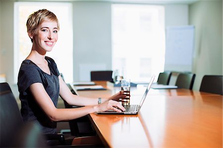 simsearch:649-07238396,k - Businesswoman using laptop at conference table Stock Photo - Premium Royalty-Free, Code: 6113-07242767