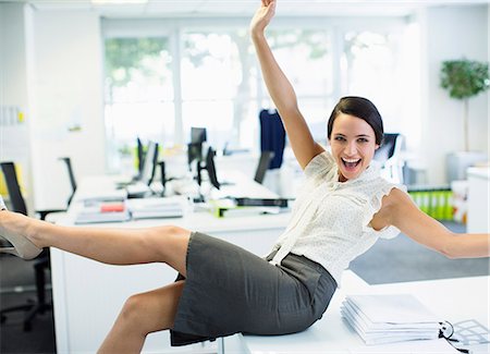 simsearch:6113-07648679,k - Businesswoman cheering in office Stock Photo - Premium Royalty-Free, Code: 6113-07242727