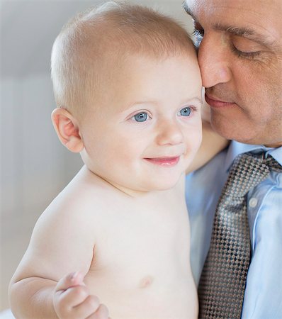 Father holding baby Stock Photo - Premium Royalty-Free, Code: 6113-07242821