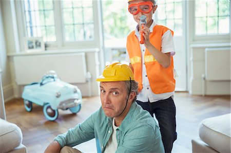 funny family playing - Father and son playing with construction toys Stock Photo - Premium Royalty-Free, Code: 6113-07242966