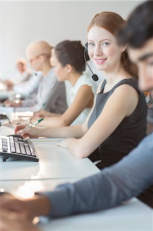 simsearch:700-01248091,k - Businesswoman wearing headset in office Stock Photo - Premium Royalty-Free, Code: 6113-07243053