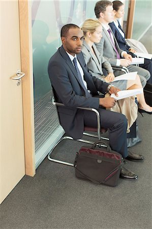 simsearch:6113-07243220,k - Business people waiting in office Stock Photo - Premium Royalty-Free, Code: 6113-07243154