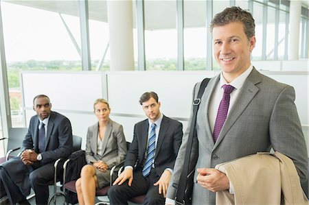 recruiting - Businessman smiling in office Stock Photo - Premium Royalty-Free, Code: 6113-07243193