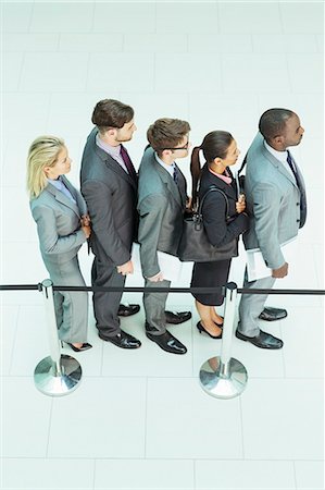 simsearch:6113-07243220,k - Business people waiting in line Stock Photo - Premium Royalty-Free, Code: 6113-07243198