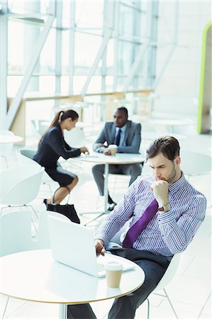 simsearch:6113-06753440,k - Business people working in office lobby Stock Photo - Premium Royalty-Free, Code: 6113-07243108