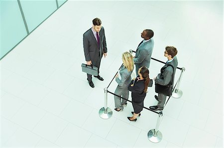 Businessman standing outside roped-off square Foto de stock - Sin royalties Premium, Código: 6113-07243264