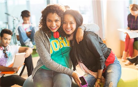 simsearch:6113-07542497,k - University students smiling together in lounge Stock Photo - Premium Royalty-Free, Code: 6113-07243271