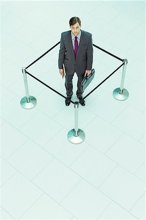 simsearch:6113-07243220,k - Businessman standing in roped-off square Stock Photo - Premium Royalty-Free, Code: 6113-07243220