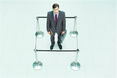 simsearch:6113-07243220,k - Businessman standing in roped-off square Stock Photo - Premium Royalty-Free, Code: 6113-07243232