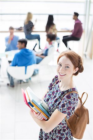 student back pack - University student smiling in lounge Stock Photo - Premium Royalty-Free, Code: 6113-07243349