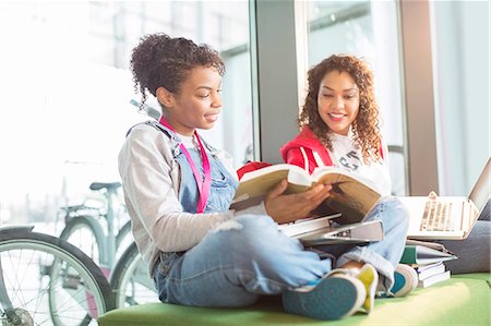 University students working together on bench Stock Photo - Premium Royalty-Free, Code: 6113-07243358