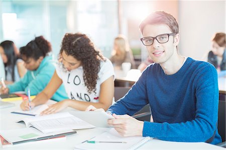 students in classroom - University student using digital tablet in classroom Stock Photo - Premium Royalty-Free, Code: 6113-07243367