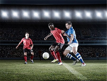 stadium night - Soccer players with ball on field Stock Photo - Premium Royalty-Free, Code: 6113-07310543