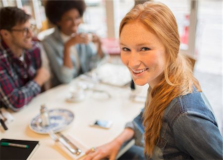 Friends enjoying coffee in cafe Stock Photo - Premium Royalty-Free, Code: 6113-07542488