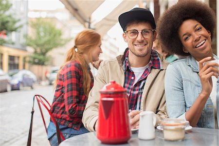 simsearch:6113-07543549,k - Couple drinking coffee at sidewalk cafe Stock Photo - Premium Royalty-Free, Code: 6113-07542498
