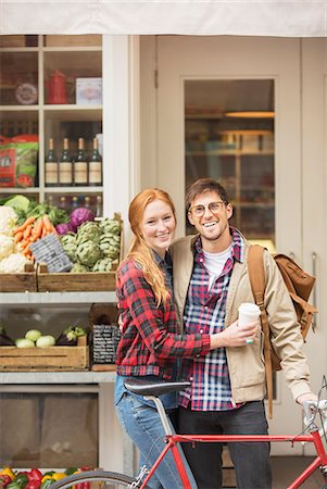 Couple hugging on city street Stock Photo - Premium Royalty-Free, Code: 6113-07542414