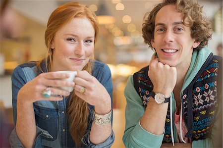 simsearch:6113-07543549,k - Couple smiling together in cafe Stock Photo - Premium Royalty-Free, Code: 6113-07542439