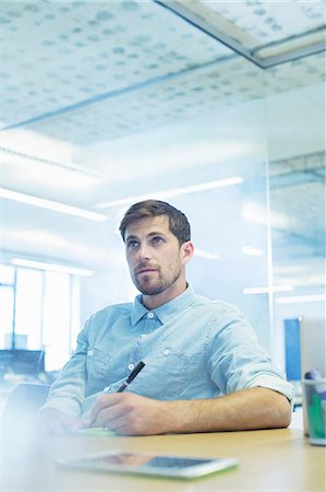 Businessman taking notes in meeting Stock Photo - Premium Royalty-Free, Code: 6113-07542552