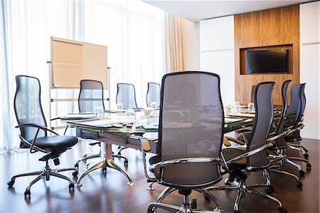 simsearch:6113-07589083,k - Chairs and table in empty meeting room Photographie de stock - Premium Libres de Droits, Code: 6113-07542643