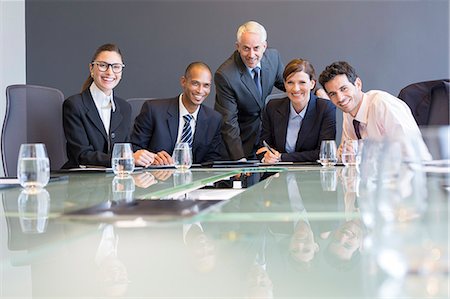 simsearch:6113-07159049,k - Business people smiling in meeting Stock Photo - Premium Royalty-Free, Code: 6113-07542606