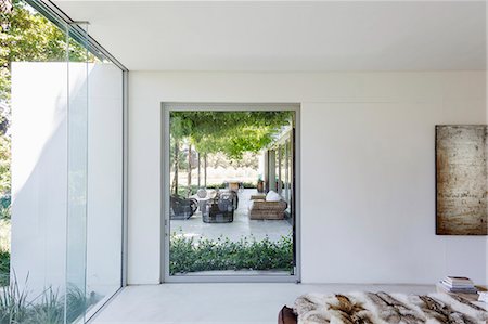 simsearch:6113-07542742,k - Bedroom window overlooking luxury garden patio Stock Photo - Premium Royalty-Free, Code: 6113-07542736