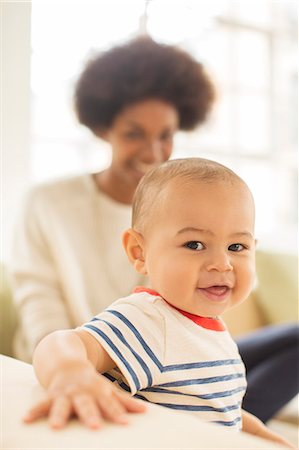 simsearch:6113-07543258,k - Mother and baby boy sitting on sofa Photographie de stock - Premium Libres de Droits, Code: 6113-07542828