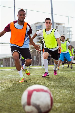 simsearch:6113-07588867,k - Soccer players training on field Stock Photo - Premium Royalty-Free, Code: 6113-07543113