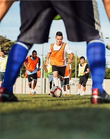 Soccer players training on field Stock Photo - Premium Royalty-Free, Code: 6113-07543119