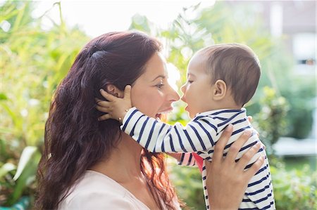 simsearch:6113-07543218,k - Mother holding baby girl outdoors Stock Photo - Premium Royalty-Free, Code: 6113-07543139
