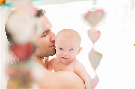 portrait man shoulder - Father holding baby girl Stock Photo - Premium Royalty-Free, Code: 6113-07543240