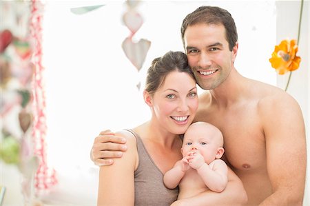 Parents and baby girl smiling together Foto de stock - Sin royalties Premium, Código: 6113-07543201