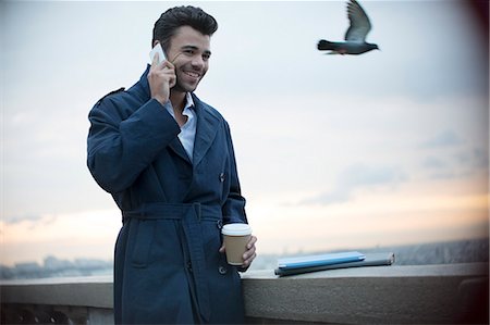 sunrise people - Businessman on cell phone outdoors Stock Photo - Premium Royalty-Free, Code: 6113-07543396