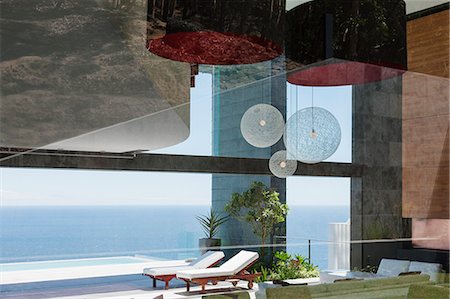 simsearch:6113-07542742,k - Patio of modern house overlooking ocean Stock Photo - Premium Royalty-Free, Code: 6113-07543332
