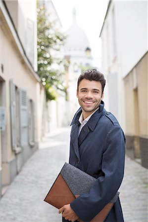 portfolio - Businessman smiling on street with Sacre Coeur Basilica in background, Paris, France Stock Photo - Premium Royalty-Free, Code: 6113-07543484