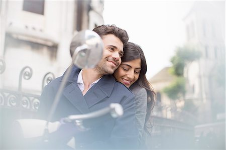 simsearch:6113-07543549,k - Couple sitting on scooter in city Stock Photo - Premium Royalty-Free, Code: 6113-07543541