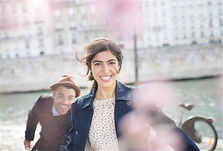 fun couple - Couple laughing and running along Seine River, Paris, France Stock Photo - Premium Royalty-Free, Code: 6113-07543571