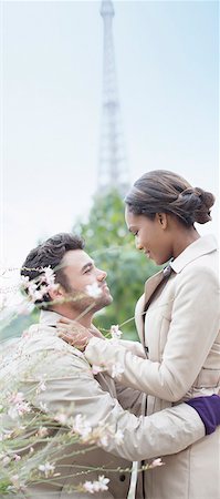 romance in paris - Couple hugging in front of Eiffel Tower, Paris, France Stock Photo - Premium Royalty-Free, Code: 6113-07543592