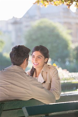 simsearch:6113-07543676,k - Couple talking on park bench Stock Photo - Premium Royalty-Free, Code: 6113-07543667