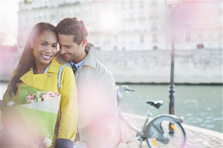 simsearch:6113-07543549,k - Couple with bouquet of flowers by Seine River, Paris, France Stock Photo - Premium Royalty-Free, Code: 6113-07543670