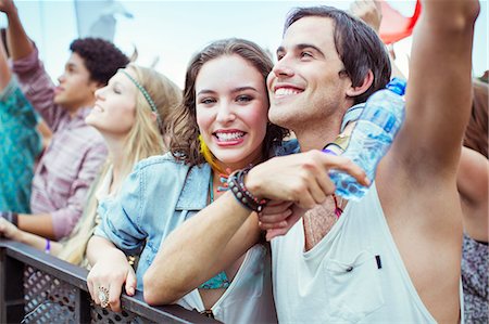Couple cheering at music festival Stock Photo - Premium Royalty-Free, Code: 6113-07564767