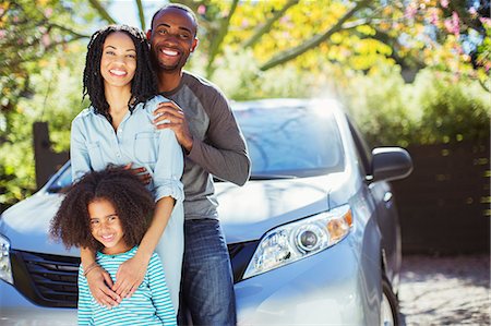 driveway - Portrait of happy family outside car Stock Photo - Premium Royalty-Free, Code: 6113-07564984