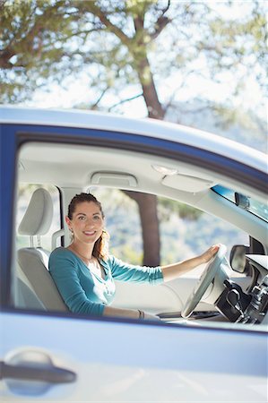 driving - Portrait of smiling woman inside car Stock Photo - Premium Royalty-Free, Code: 6113-07565043