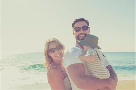 family outdoor lens flare - Portrait of happy family on sunny beach Stock Photo - Premium Royalty-Free, Code: 6113-07565152