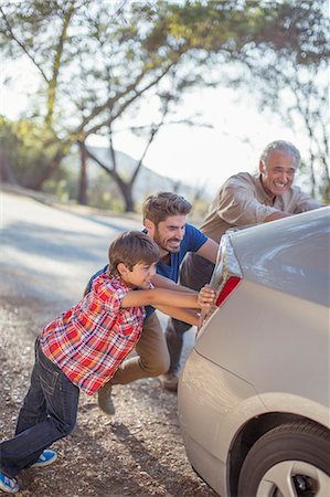 father grandson - Multi-generation men pushing car at roadside Stock Photo - Premium Royalty-Free, Code: 6113-07565108