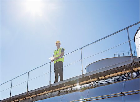 simsearch:6113-07565342,k - Worker on platform above milk tanker Stock Photo - Premium Royalty-Free, Code: 6113-07565352