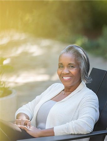 senior adult relaxing portrait not child - Portrait of smiling senior woman outdoors Stock Photo - Premium Royalty-Free, Code: 6113-07565460