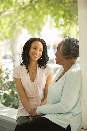 senior with daughter - Mother and daughter talking on porch Stock Photo - Premium Royalty-Free, Code: 6113-07565468