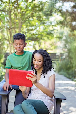 simsearch:6113-06908842,k - Mother and son using digital tablet outdoors Stock Photo - Premium Royalty-Free, Code: 6113-07565496