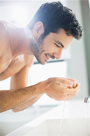 face sideview - Close up of man washing face at sink Stock Photo - Premium Royalty-Free, Code: 6113-07565726